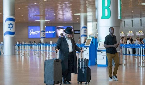 Travelers line up at Ben Gurion International Airport near Tel Aviv, occupied Palestine, Monday Sept. 2, 2024. (AP)