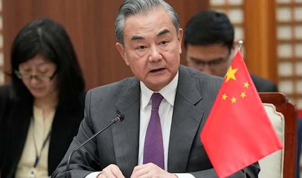 Chinese Foreign Minister Wang Yi speaks during the trilateral foreign ministers' meeting with South Korea and Japan, in Busan, South Korea, Sunday, Nov. 26, 2023 (AP)