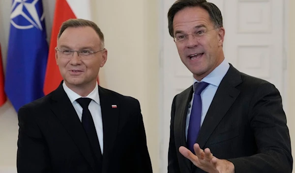 NATO Secretary General Mark Rutte, right, meets with Poland's President Andrzej Duda, left, in Warsaw, Poland, Wednesday, Nov. 13, 2024.(AP Photo/Czarek Sokolowski)