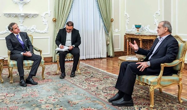 Iranian President Masoud Pezeshkian, speaks with IAEA, Director General Rafael Mariano Grossi, during their meeting in Tehran, Iran, Nov. 14, 2024. (Iranian Presidency Office via AP)