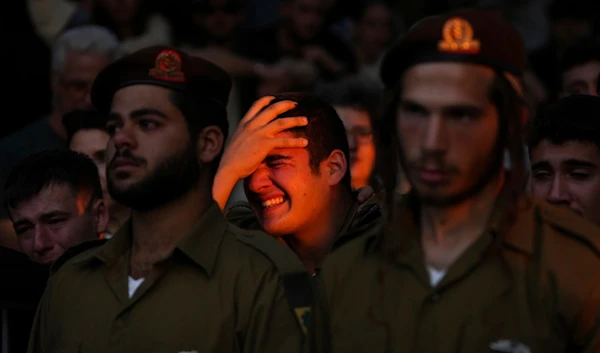 Israeli soldier cries during funeral of a captain killed in action in Lebanon, Thursday, Nov. 14, 2024. (AP)