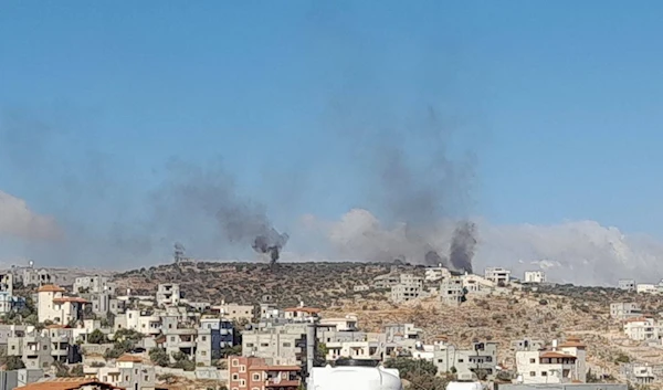 Smoke rises as Israeli settler gangs set Palestinian properties ablaze in the town of Best Fur, Nablus, November 16, 2024 (Social Media)