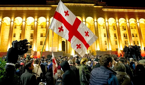 Protesters with Georgian flags rally in Tbilisi, Georgia, Tuesday, Nov. 9, 2021. (AP)