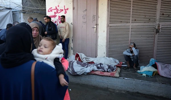 Palestinians mourn nine people killed in an Israeli strike in Bureij refugee camp, Gaza Strip, Friday, Nov. 15, 2024. (AP)