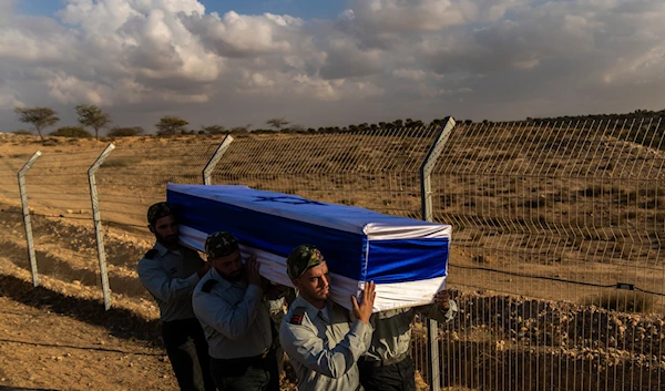 sraeli soldiers carry the coffin of captain Yogev Pazi, who was killed in Gaza, during his funeral at the cemetery of Giv'ot Bar, southern Israel, Monday, Nov. 18, 2024. (AP)