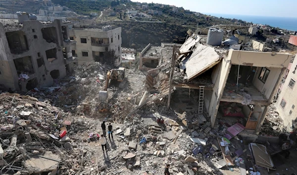 Civil defense workers check the site of a building that collapsed after it was hit by an Israeli airstrike in Hadath, south of Beirut, Lebanon, Sunday, Nov. 17, 2024. (AP)