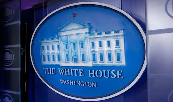 A plaque depicting the White House is posted behind a podium in the James Brady Press Briefing Room of the White House, Sunday, March 22, 2020, in Washington. (AP)