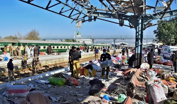 Security officials examine the site of a bomb explosion at a railway station in Quetta, southwestern Pakistan, on November 9, 2024. (AP)