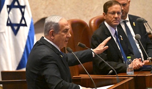 Israeli Prime Minister Benjamin Netanyahu speaks at the opening of the 25th Knesset session, in occupied al-Quds, Monday, Oct. 28, 2024. (AP)