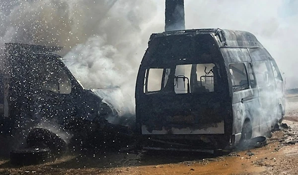 A truck and ambulance burn after Israeli airstrikes hit a group of paramedics outside a hospital in Marjayoun, south Lebanon, Friday, Oct. 4, 2024. (AP)