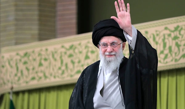 Leader Sayyed Ali Khamenei waves to the crowd during a meeting with school and university students, in Tehran, Iran, Saturday, Nov. 2, 2024. (Office of the Iranian Supreme Leader via AP)