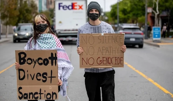 Student protesters outside of UC San Francisco’s Rutter Center call for the UC system to divest from investments in Israeli companies as the UC Board of Regents holds meetings inside the university, in San Francisco, on July 17, 2024. (AP