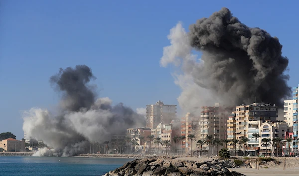 Smoke rises from buildings hit in Israeli airstrikes in Tyre, southern Lebanon, on October 28, 2024. (AP)