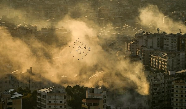 A flock of birds flies as smoke rises from the site of an Israeli airstrike in Dahiyeh, in the southern suburb of Beirut, Lebanon, Thursday, October 24, 2024. (AP)