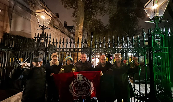 British firefighters demand donation release outside Israeli embassy