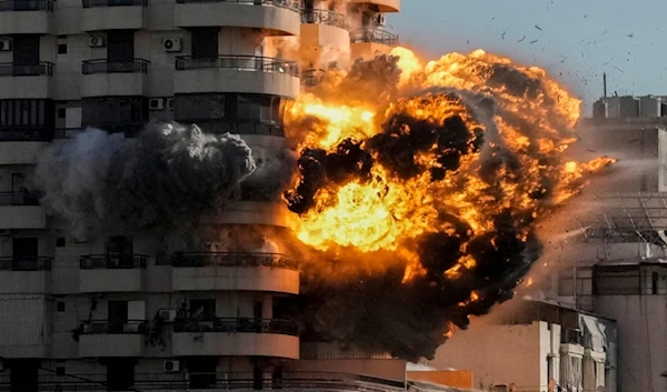 Smoke and flames erupt from a building hit in an Israeli airstrike in Chiyah, in the southern suburb of Beirut, Lebanon, Friday, Nov. 22, 2024. (AP)