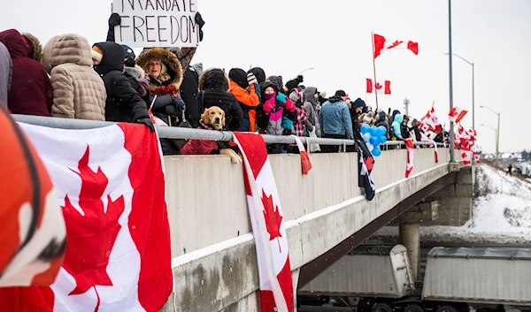 Protestors show their support for the Freedom Convoy of truck drivers who are making their way to Ottawa to protest against COVID-19 vaccine mandates by the Canadian government on January 27, 2022, in Vaughan. (AP)