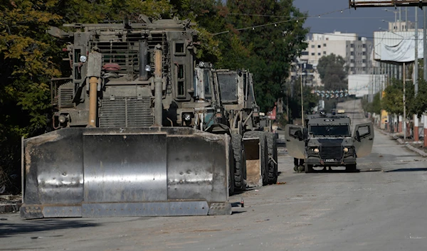 Israeli bulldozers and vehicle is seen during a military operation in the West Bank of Jenin, on November 20, 2024. (AP)