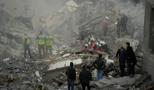 Rescue workers and people search for victims at the site of an Israeli airstrike that hit central Beirut, Lebanon, Saturday, Nov. 23, 2024. (AP)