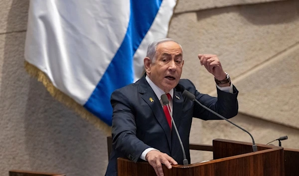 Israeli Prime Minister Benjamin Netanyahu addresses lawmakers in the Knesset in occupied al-Quds, occupied Palestine, Monday, Nov. 18, 2024 (AP)