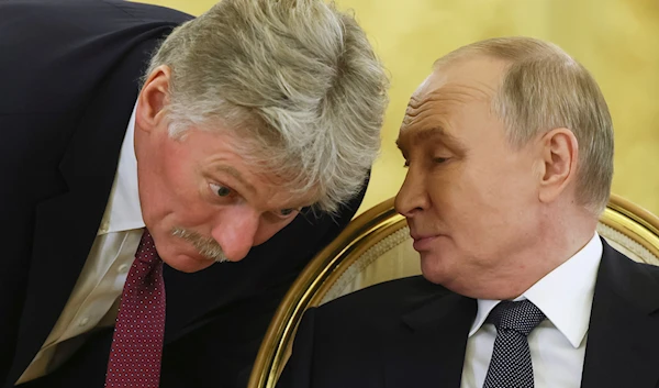 Russian President Vladimir Putin, right, speaks with Kremlin spokesman Dmitry Peskov during an extended meeting at the summit of the heads of state of the Commonwealth of Independent States (CIS) at the Kremlin in Moscow, Russia, October 8, 2024. (AP)