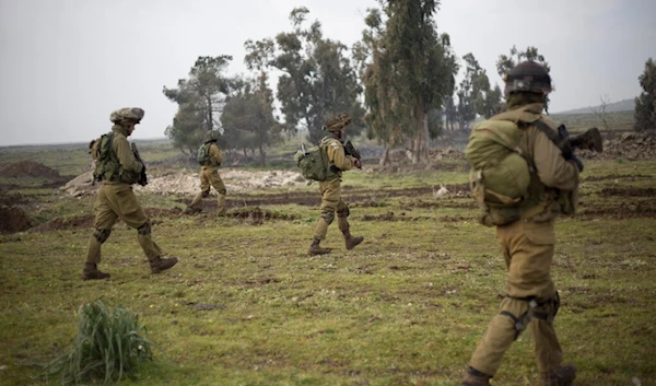 Israeli soldiers of the Golani brigade march during training in the occupied Syrian Golan Heights, near the Palestine-Syria border, Monday, Jan. 19, 2015. (AP)