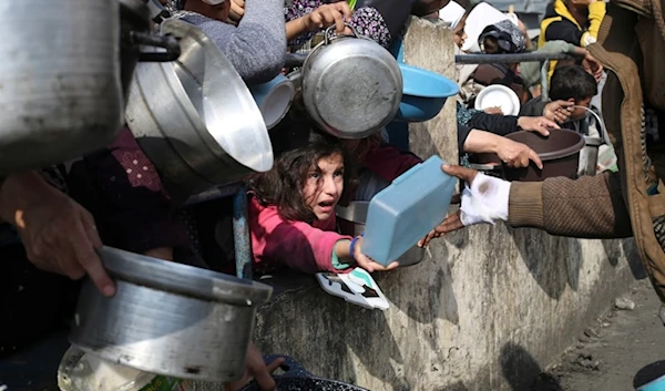 Palestinians line up for food during in Rafah, in the southern Gaza Strip, Palestine, on January 9, 2024. (AP)