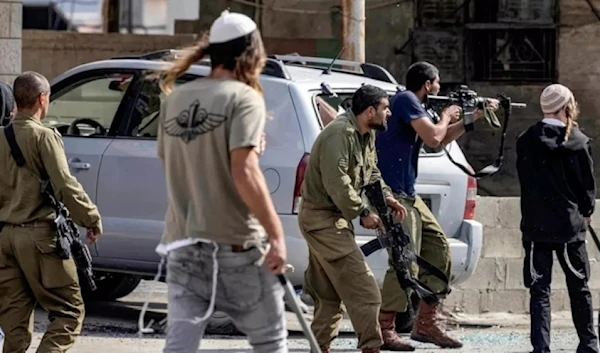 Israeli settlers fire at Palestinians in the West Bank on October 12, 2022. (AFP)