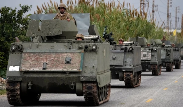 Lebanese soldiers ride in a convoy in Mansouri, as they head to southern Lebanon, following a ceasefire between the Israeli occupation and Hezbollah that went into effect on Wednesday, November 27, 2024 (AP)