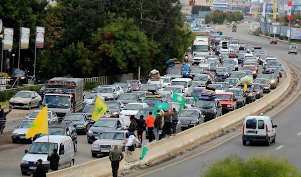 People sit in traffic as they return to their villages after a ceasefire between the Israeli occupation and Hezbollah went into effect in Ghazieh, Lebanon, Wednesday, November 27, 2024 (AP)