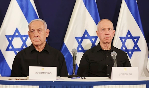 Israeli Prime Minister Benjamin Netanyahu, left, and Defense Minister Yoav Gallant attend a press conference in the Kirya military base in Tel Aviv, occupied Palestine, Oct. 28, 2023. (AP)