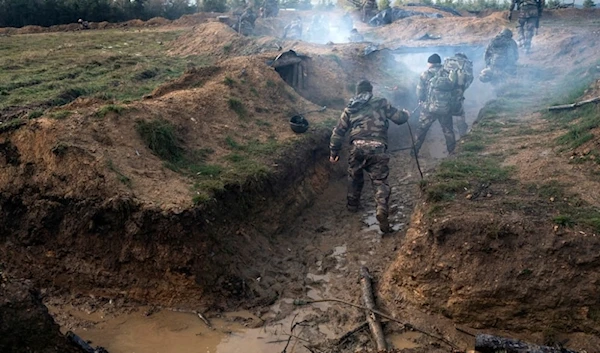 Ukrainian infantrymen train with French soldiers to learn combat skills, in France, Tuesday, Nov. 7, 2023. (AP)