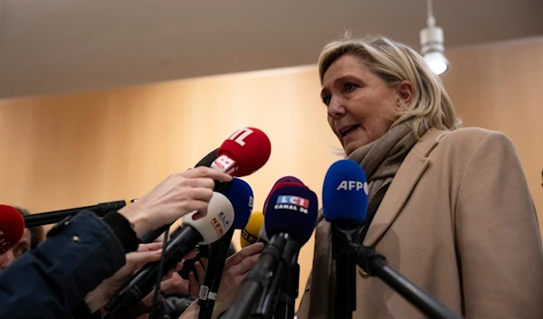 French right-wing leader Marine Le Pen answers reporters after the last day of the trial on charges of embezzling European Parliament funds, in Paris, Wednesday, Nov. 27, 2024. (AP)