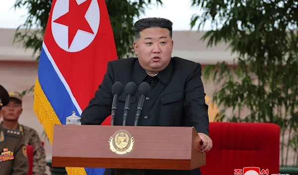 In this photo provided by the DPRK government, DPRK leader Kim Jong Un speaks as he visits an air force helicopter unit to praise the troops for helping rescue people from recent floods, at an undisclosed location in North Korea, Friday, Aug. 2, 2024. (AP)