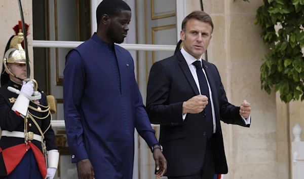 French President Emmanuel Macron and Senegalese President Bassirou Diomaye Faye leave the Elysee Palace after a lunch, in Paris, Thursday June 20 2024. (AP)