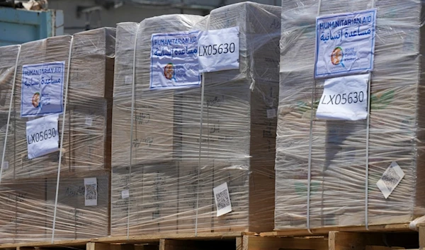 A bundle of humanitarian aid for the Gaza Strip with the logo of World Central Kitchen (WCK) is seen at the Kerem Abu Salem border crossing in southern occupied Palestine, Thursday, May 30, 2024 (AP)