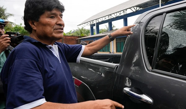 Former Bolivia's President Evo Morales points to a bullet hole on his car that he claims was the result of an assassination attempt, in Lauca N, Chapare region, Bolivia, Sunday, November 3, 2024 (AP)