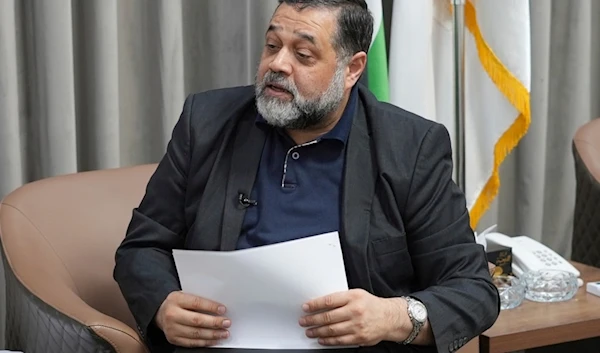 Hamas political official Osama Hamdan speaks during an interview with The Associated Press in Doha, Qatar, Tuesday August 13, 2024 (AP)