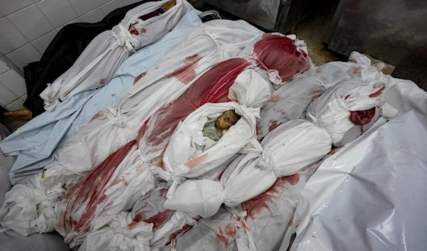 Bodies of Palestinians killed in the Israeli bombardment of the Gaza Strip are seen at a hospital morgue in Deir al-Balah, Friday, Nov. 1, 2024.