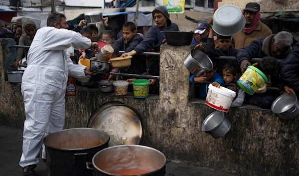 Palestinians line up for free food in Rafah, Gaza Strip, Feb. 23, 2024.