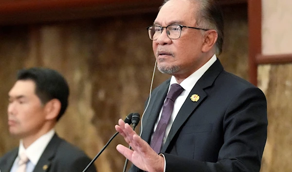 Malaysian Prime Minister Anwar Ibrahim delivers his speech during a press conference at Japan National Press Club in Tokyo on May 24, 2024. (AP)