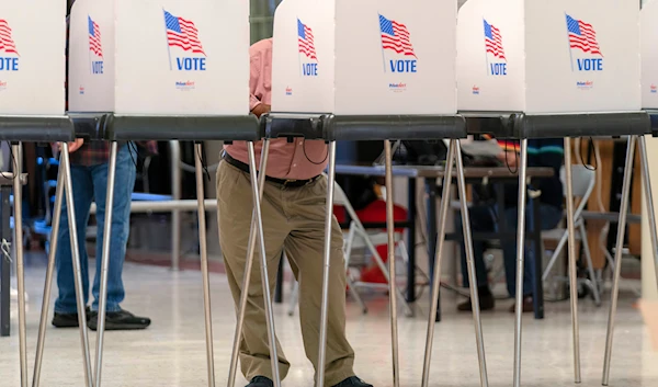 People cast their ballot during Election Day 2024 at John F. Kennedy High School in Silver Spring Md, on November 5, 2024. (AP)