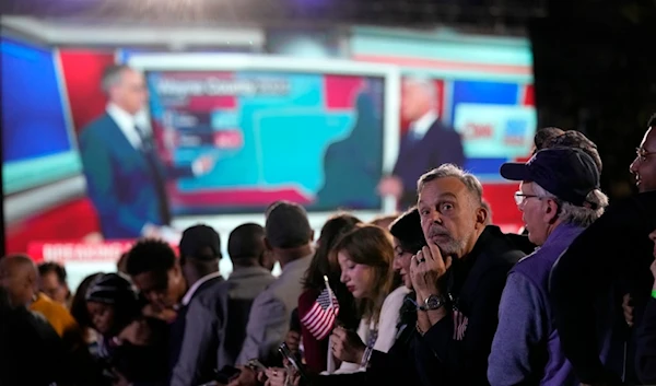 Supporters watch as results come in at an election night campaign watch party for Democratic presidential nominee Vice President Kamala Harris, Tuesday, November 5, 2024, on the campus of Howard University in Washington (AP)