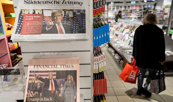 Newspapers front-pages with President-elect Donald Trump are seen at a station kiosk in Cologne, Germany, Thursday, Nov. 7, 2024. (AP Photo/Martin Meissner)