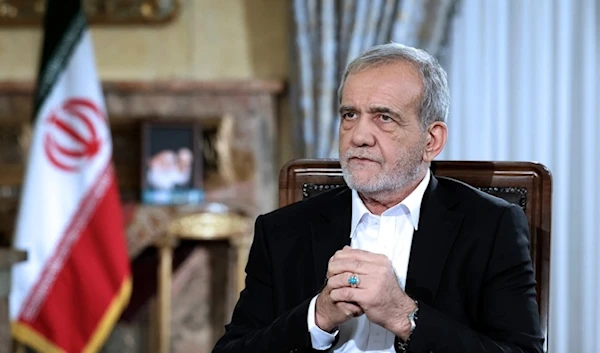 Iranian President Masoud Pezeshkian speaks in live televised interview on state TV, at his office in  Tehran, Iran Saturday August, 2024. (Iranian Presidency via AP)