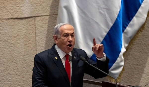 Israeli Prime Minister Benjamin Netanyahu addresses lawmakers in the Knesset in occupied al-Quds, on Monday, November 18,2024. (AP)