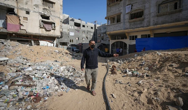 Ahmed Algharbli shows the area where he last saw his father, Mahmoud Alghrabli, in Khan Younis, Gaza Strip, Nov. 21, 2024. (AP )