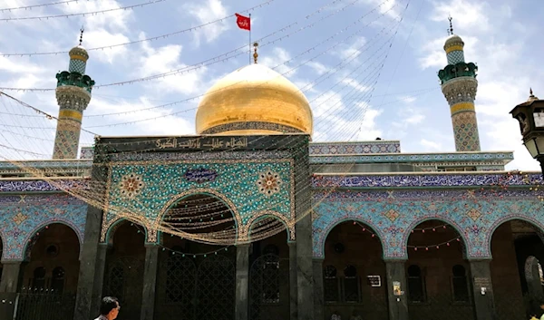 A man walks inside the Sayyidah Zaynab Shrine, in the Sayyidah Zaynab suburb of Damascus, Syria, Friday, May 19, 2017. (AP)