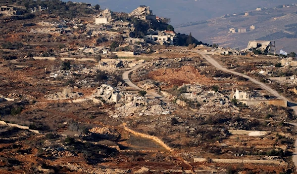 Destroyed buildings in the village of Kfar Kila, southern Lebanon, are seen from northern Israel, Dec. 3, 2024. (AP Photo/Maya Alleruzzo)