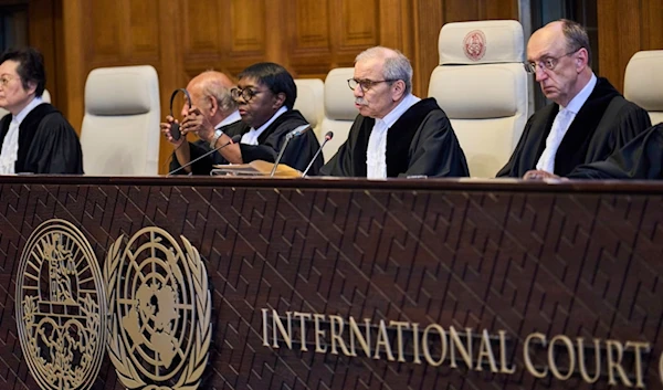 Presiding Judge Nawaf Salam reads the ruling in the International Court of Justice, or World Court, in The Hague, Netherlands, Friday, July 19, 2024 (AP)